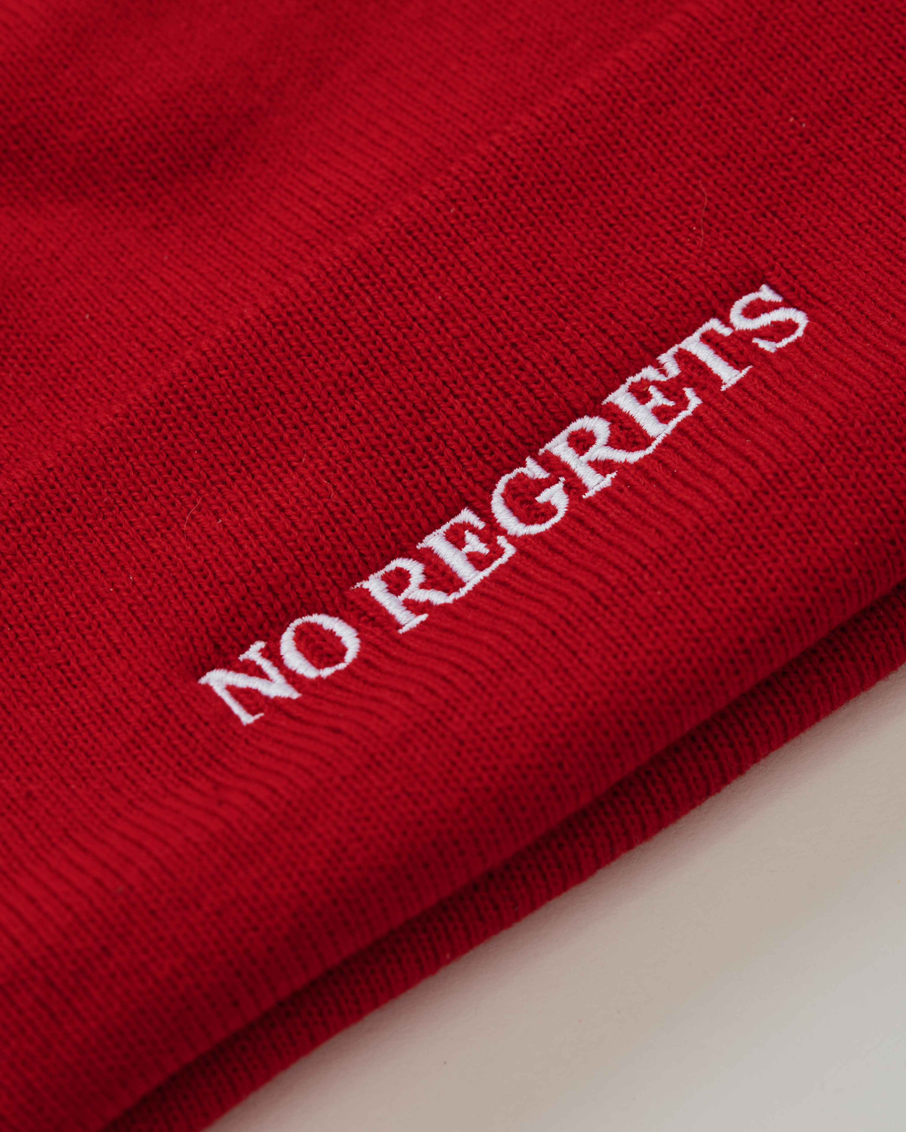 No Regrets beanie in red close-up